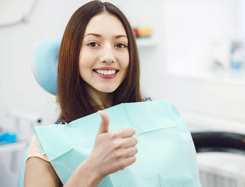 Happy patient after getting dental implants at The Smile Spa